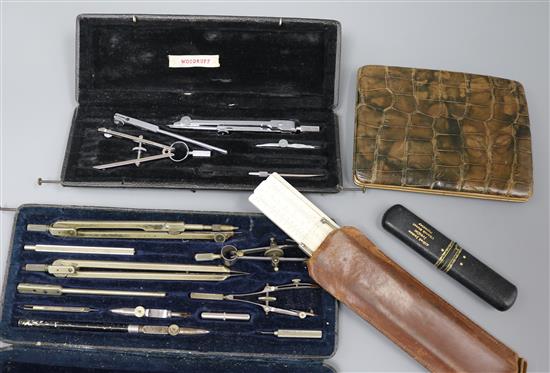 A silver and mother of pearl fruit knife, crocodile wallet and drawing instruments